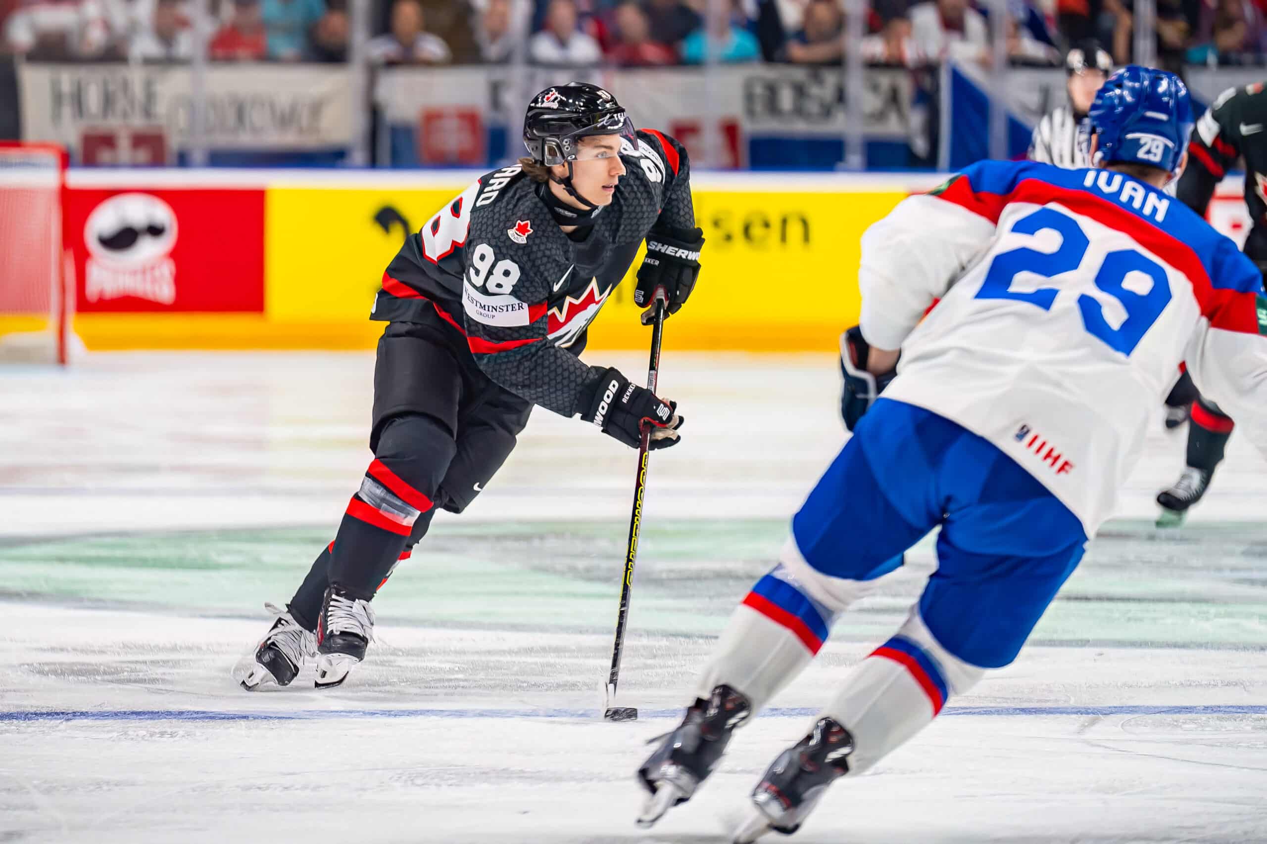 Connor Bedard of Canada, the rookie of the year nhl awards odds favourite, Michal Ivan of Slovakia controls the puck during the 2024 IIHF Ice Hockey World Championship Czechia quarterfinal match between Canada and Slovakia on May 23, 2024 in Prague, Czech Republic. (Photo by Pasi Suokko/Apollo Photo/DeFodi Images via Getty Images)