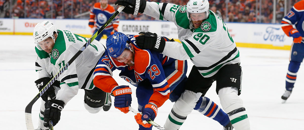 Ryan Suter #20 of the Dallas Stars checks Leon Draisaitl #29 of the Edmonton Oilers during the second period in Game Three of the Western Conference Final of the 2024 Stanley Cup Playoffs at Rogers Place on May 27, 2024 in Edmonton, Alberta, Canada.