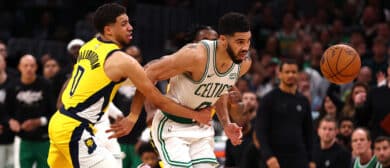 Tyrese Haliburton #0 of the Indiana Pacers fouls Jayson Tatum #0 of the Boston Celtics during overtime in Game One of the Eastern Conference Finals at TD Garden on May 21, 2024 in Boston, Massachusetts.