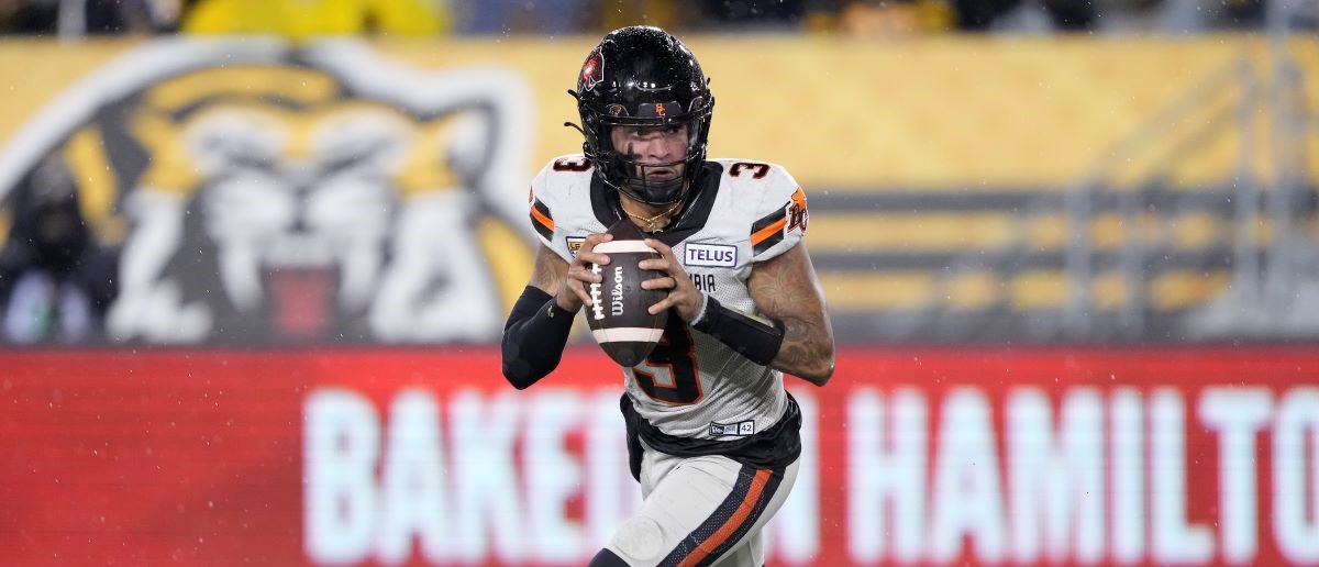 Vernon Adams Jr. #3 of the BC Lions rolls out to pass against the Hamilton Tiger-Cats at Tim Hortons Field on October 13, 2023 in Hamilton, Canada