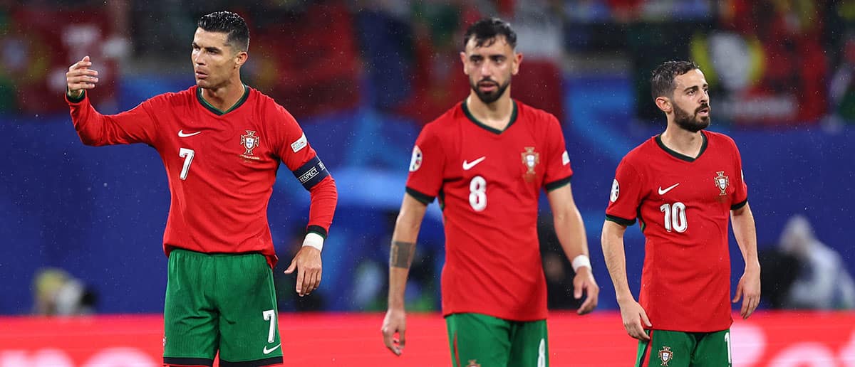 Cristiano Ronaldo Bruno Fernandes and Bernardo Silva of Portugal react after Czech Republic score a goal to make it 1-0 during the UEFA EURO 2024 group stage match between Portugal and Czechia at Football Stadium Leipzig on June 18, 2024 in Leipzig, Germany.