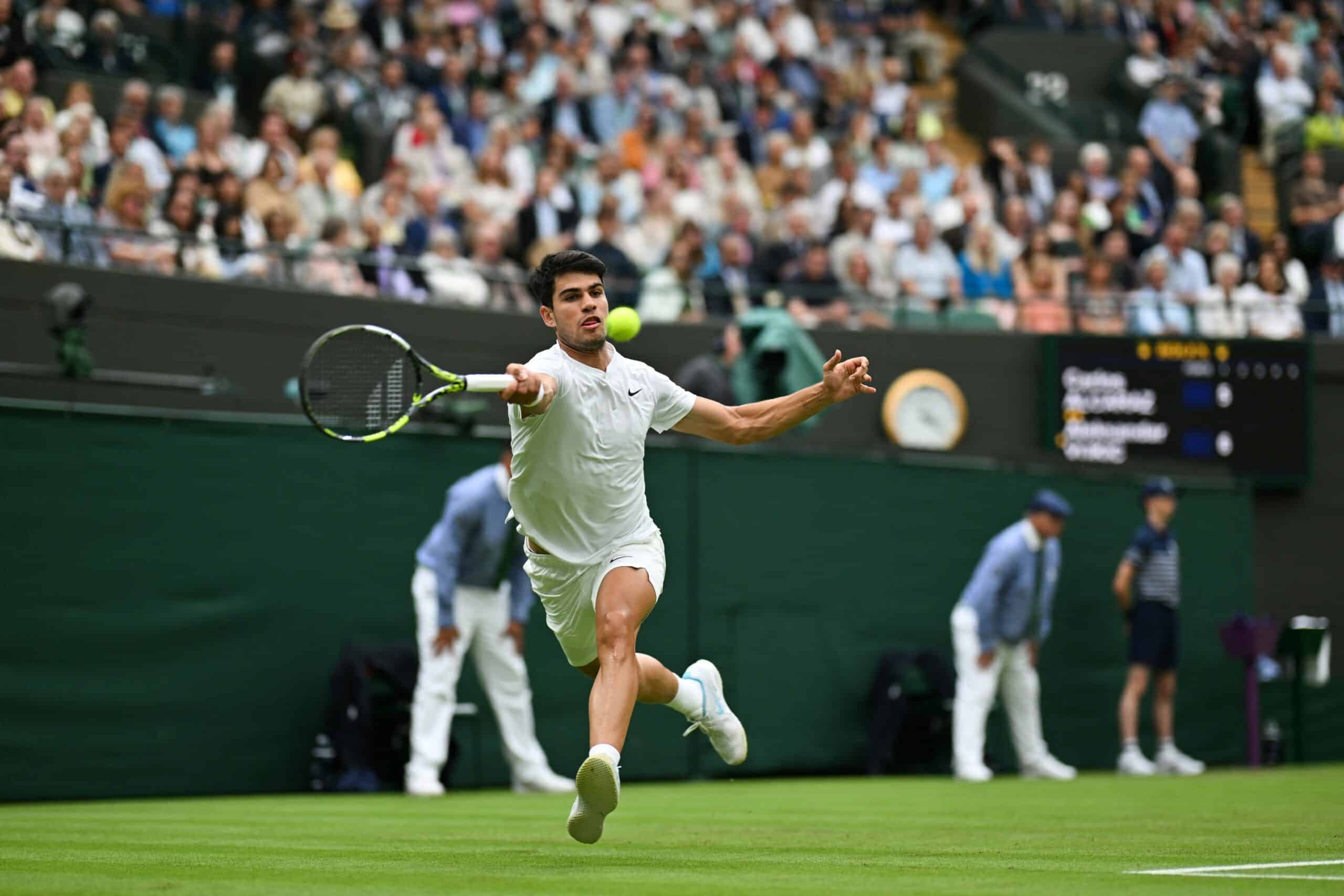 Spain's Carlos Alcaraz returns against Australia's Aleksander Vukic during their men's singles second round tennis match on the third day of the 2024 Wimbledon Championships at The All England Lawn Tennis and Croquet Club in Wimbledon, southwest London, on July 3, 2024. (Photo by ANDREJ ISAKOVIC / AFP) / RESTRICTED TO EDITORIAL USE (Photo by ANDREJ ISAKOVIC/AFP via Getty Images)