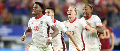 Canada's forward #10 Jonathan David celebrates alongside teammates their victory after a penalty shoot-out during the Conmebol 2024 Copa America tournament quarter-final football match between Venezuela and Canada at AT&T Stadium in Arlington, Texas, on July 5, 2024.