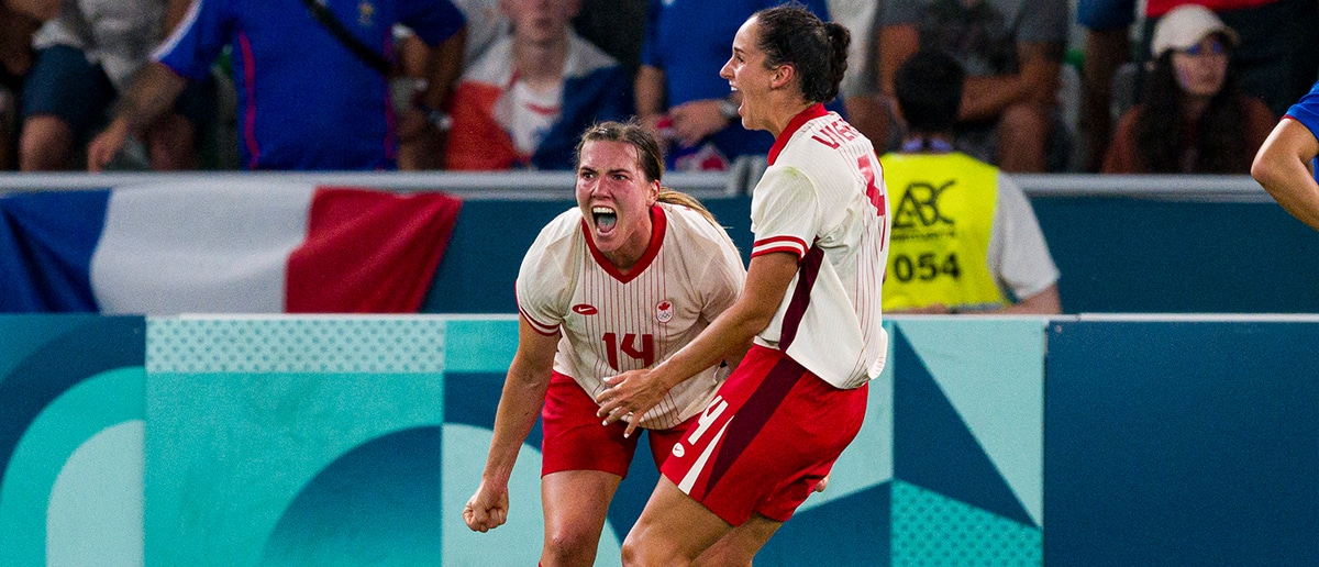 Vanessa Gilles of Canada (L) celebrating her goal with her teammates during the Women's Football Group A match between France and Canada on day two of the Olympic Games Paris 2024 at Stade Geoffroy-Guichard on July 28, 2024 in Saint-Etienne, France.