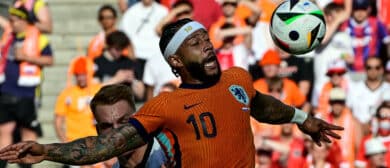Netherlands' forward #10 Memphis Depay controls the ball past Austria's defender #15 Philipp Lienhart during the UEFA Euro 2024 Group D football match between the Netherlands and Austria at the Olympiastadion in Berlin on June 25, 2024.