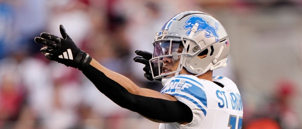 Amon-Ra St. Brown #14 of the Detroit Lions reacts after catching a pass for a first down during the second quarter against the San Francisco 49ers in the NFC Championship Game at Levi's Stadium on January 28, 2024 in Santa Clara, California.