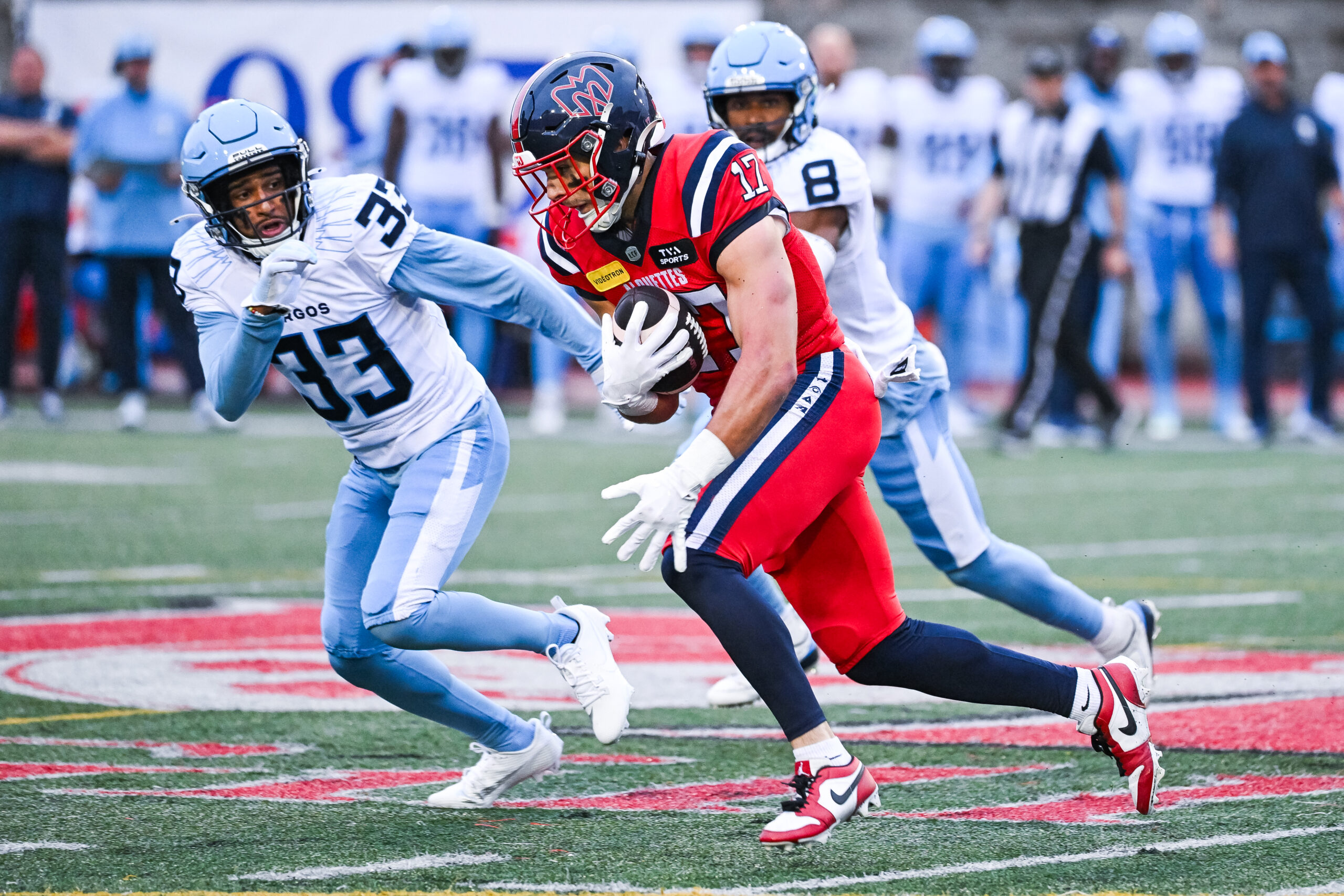 MONTREAL, QC - JULY 11: Montreal Alouettes wide receiver Cole Spieker (17) runs the ball against Toronto Argonauts defensive back Amani Dennis (33) during the Toronto Argonauts versus the Montreal Alouettes game on July 11, 2024, at Percival Molson Memorial Stadium in Montreal, QC (Photo by David Kirouac/Icon Sportswire via Getty Images)