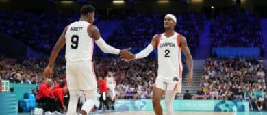 RJ Barrett #9 high fives Shai Gilgeous-Alexander #2 of the Canadian Mens National Team during the game on July 30, 2024 at the Stade Pierre Mauroy in Paris, France.