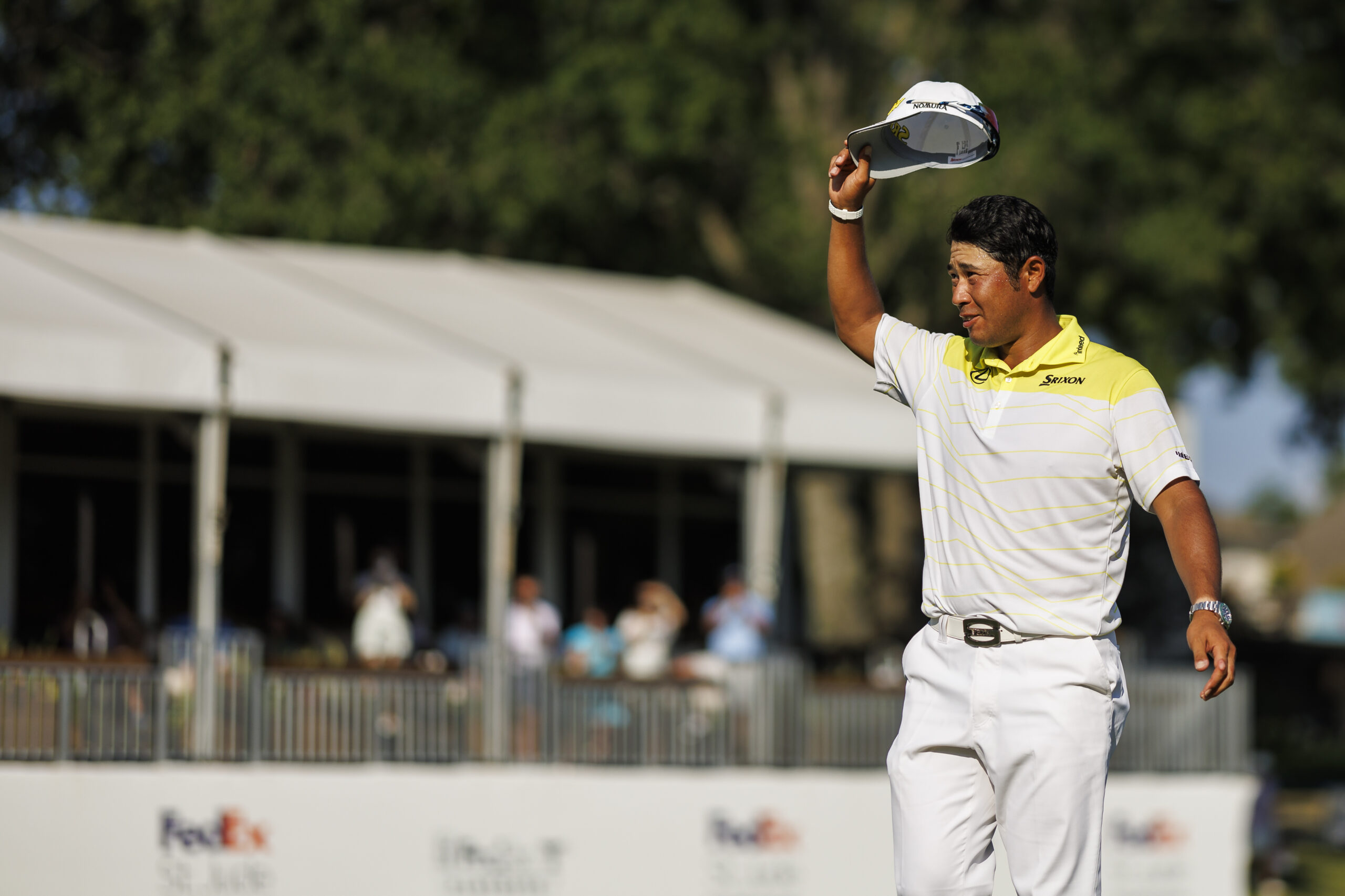 MEMPHIS, TENNESSEE - AUGUST 18: Hideki Matsuyama of Japan acknowledges the crowd on the 18th green after winning the FedEx St. Jude Championship at TPC Southwind on August 18, 2024 in Memphis, Tennessee. (Photo by James Gilbert/PGA TOUR via Getty Images)