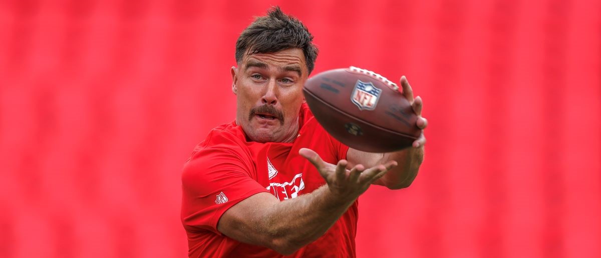 Travis Kelce #87 of the Kansas City Chiefs catches a warmup pass prior to a preseason game against the Chicago Bears at GEHA Field at Arrowhead Stadium on August 22, 2024 in Kansas City,