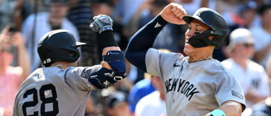 Austin Wells #28 of the New York Yankees celebrates with Aaron Judge #99 after hitting a home run against the Baltimore Orioles at Oriole Park at Camden Yards on July 13, 2024 in Baltimore, Maryland.