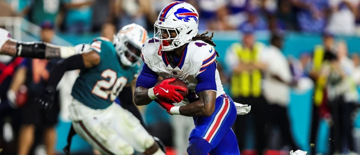 James Cook #4 of the Buffalo Bills runs the ball during an NFL football game against the Miami Dolphins at Hard Rock Stadium on September 12, 2024 in Miami Gardens, FL.