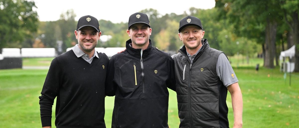 Corey Conners, Taylor Pendrith and Mackenzie Hughes of the International Team pose for a photo on the tenth hole during practice prior to the 2024 Presidents Cup at The Royal Montreal Golf Club on September 23, 2024 in Montreal, Quebec