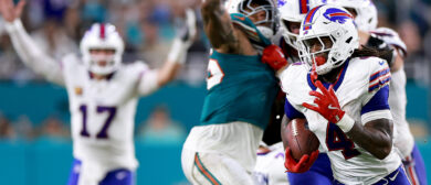 James Cook #4 of the Buffalo Bills runs the ball for 49 yards to score a touchdown against the Miami Dolphins during the second quarter in the game at Hard Rock Stadium on September 12, 2024 in Miami Gardens, Florida.