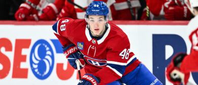 Lane Hutson #48 of the Montreal Canadiens skates the puck during the second period against the Detroit Red Wings at the Bell Centre on April 16, 2024 in Montreal, Quebec, Canada. The Detroit Red Wings defeated the Montreal Canadiens 5-4 in a shootout.