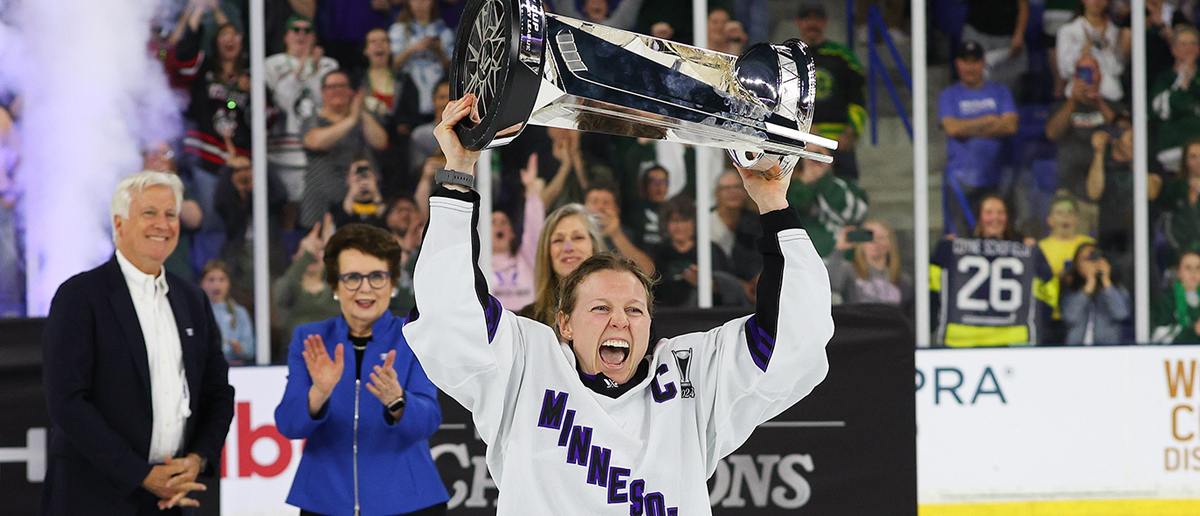 Minnesota forward Kendall Coyne Schofield (26) hoists the Walter Cup Trophy after defeating Boston in game 5 of the PWHL Walter Cup Finals on May 29, 2024, at Tsongas Center in Lowell, MA.