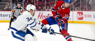 Juraj Slafkovsky #20 of the Montreal Canadiens dumps the puck during the third period of the NHL regular season game against the Toronto Maple Leafs at the Bell Centre on March 9, 2024 in Montreal, Quebec, Canada. The Toronto Maple Leafs defeated the Montreal Canadiens by a score of 3-2.