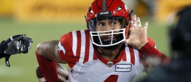 Cameron Judge #4 of the Calgary Stampeders taunts the fans after getting an interception against the Hamilton Tiger-Cats at Tim Hortons Field on September 30, 2023 in Hamilton, Canada.