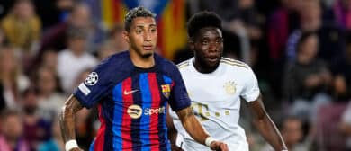 Alphonso Davies left-back of Bayern Munich and Canada and Raphinha right winger of Barcelona and Brazil compete for the ball during the UEFA Champions League group C match between FC Barcelona and FC Bayern München at Spotify Camp Nou on October 26, 2022 in Barcelona, Spain.