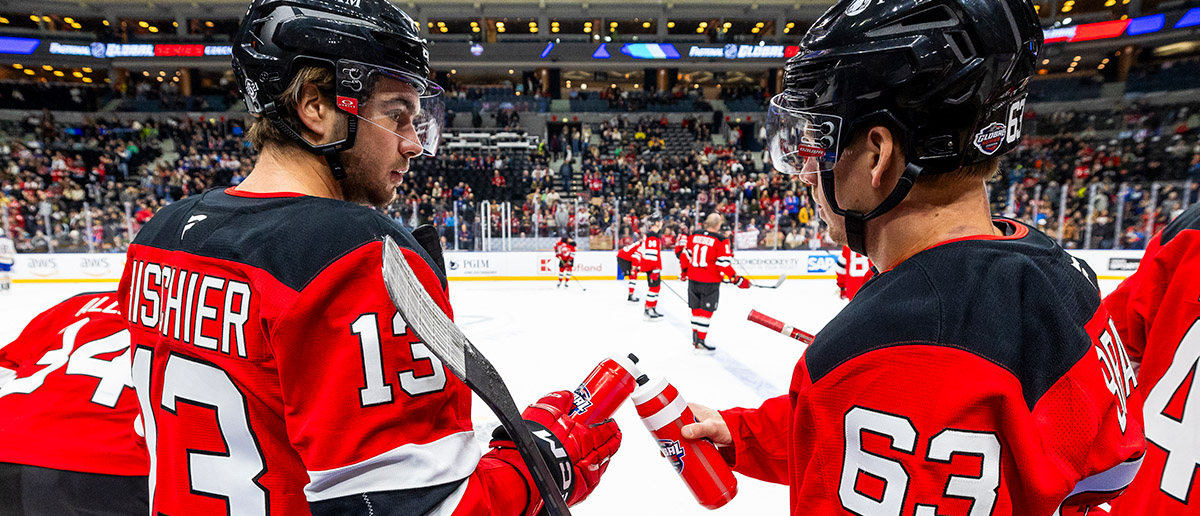 Nico Hischier #13 and Jesper Bratt #63 of the New Jersey Devils interact during warm-ups before facing the Buffalo Sabres at the 2024 NHL Global Series Czechia on October 05, 2024 in Prague, Czech Republic.