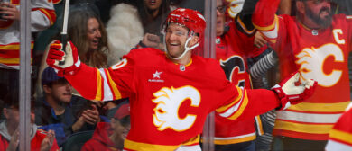 Jonathan Huberdeau #10 and teammates of the Calgary Flames celebrate a goal against the Philadelphia Flyers at the Scotiabank Saddledome on October 12, 2024 in Calgary, Alberta.