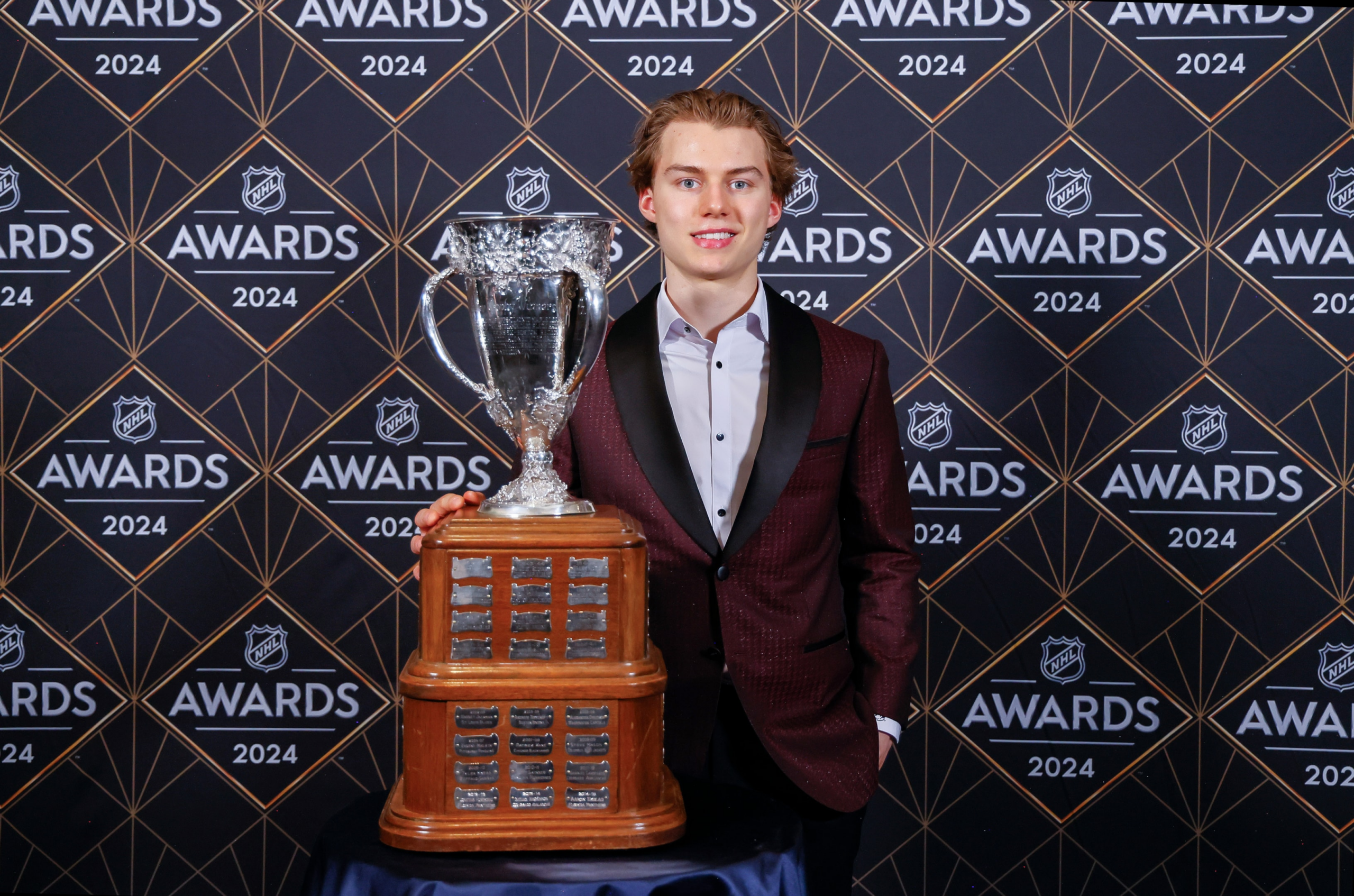 Connor Bedard of the Chicago Blackhawks poses with the Calder Memorial Trophy last season during the 2024 NHL Awards at BleauLive Theater at Fontainebleau Las Vegas on June 27, 2024 in Las Vegas, Nevada