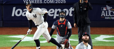 Aaron Judge #99 of the New York Yankees watches his two-run home run in the seventh inning against the Cleveland Guardians during Game Two of the American League Championship Series at Yankee Stadium on October 15, 2024 in New York City.