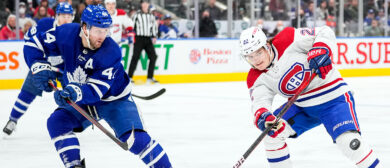 Morgan Rielly #44 of the Toronto Maple Leafs clears the puck against Cole Caufield #22 of the Montreal Canadiens during the third period at the Scotiabank Arena on April 9, 2022 in Toronto, Ontario, Canada.