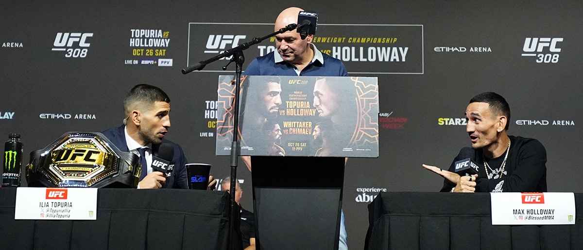 Ilia Topuria of Spain and Max Holloway exchange words during the UFC 308 press conference at Etihad Arena on October 24, 2024 in Abu Dhabi, United Arab Emirates.