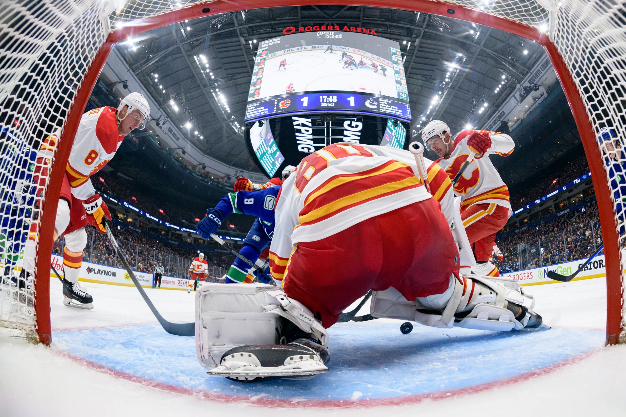 Dan Vladar of the Calgary Flames makes a save during the second period of their NHL on November 12, 2024 in Vancouver, British Columbia, Canada. 