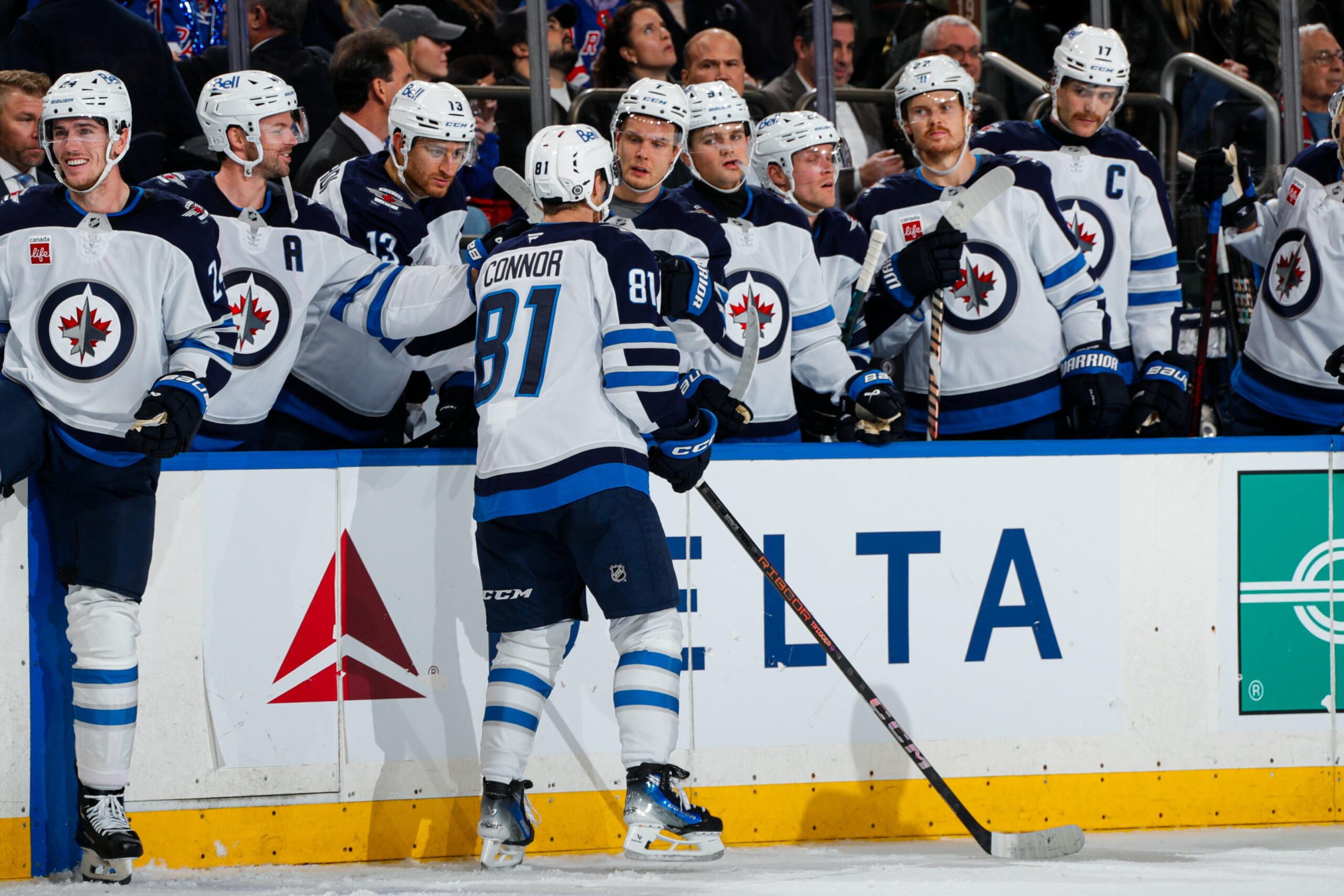 Kyle Connor of the Winnipeg Jets celebrates with teammates after scoring a goal against the New York Rangers at Madison Square Garden on November 12, 2024 in New York City.