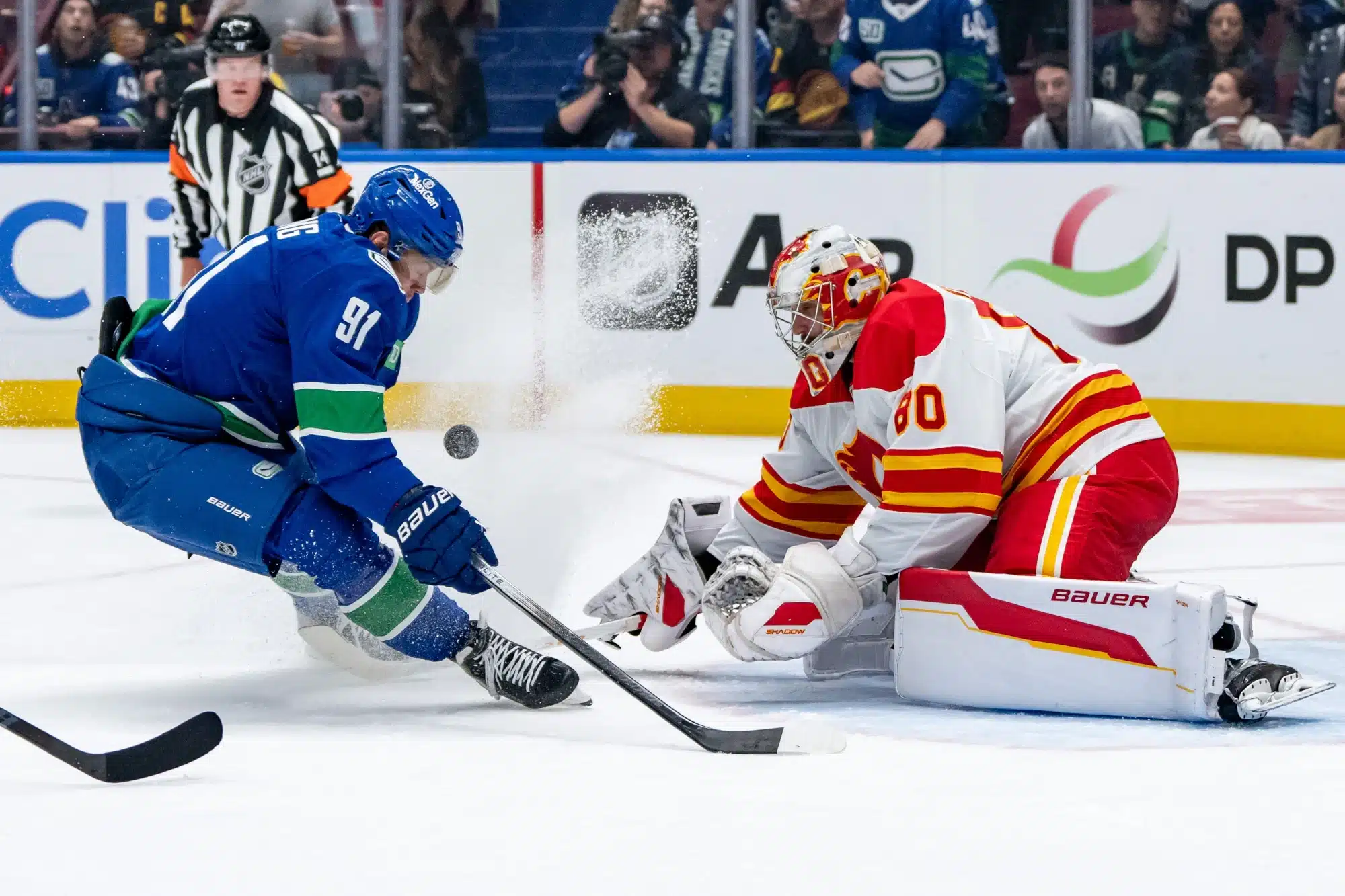 Calgary Flames goaltender Dan Vladar stops Vancouver Canucks' right wing Daniel Sprong during an NHL game between the Calgary Flames and the Vancouver Canucks on Wednesday, October 9, 2024 at Rogers Arena in Vancouver, B.C. 