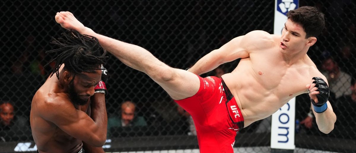 Mike Malott kicks Neil Magny in a welterweight bout during the UFC 297 event at Scotiabank Arena on January 20, 2024 in Toronto, Ontario.