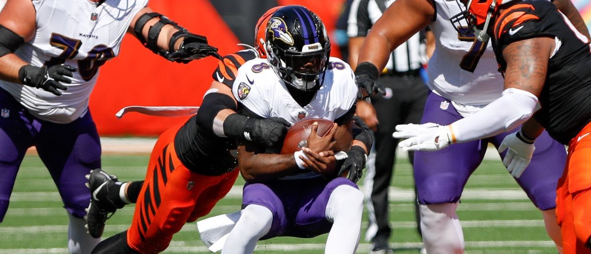 Baltimore Ravens quarterback Lamar Jackson (8) carries the ball during the game against the Baltimore Ravens and the Cincinnati Bengals on October 6, 2024, at Paycor Stadium in Cincinnati, OH.