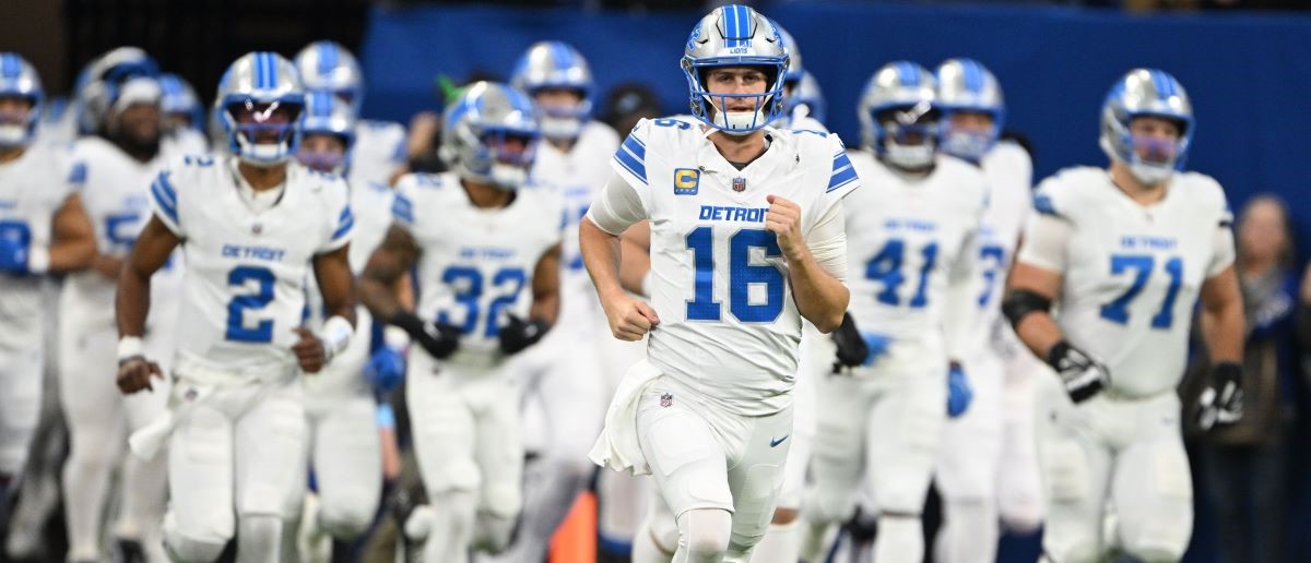 Detroit Lions quarterback Jared Goff (16) leads his team onto the field before the game against the Indianapolis Colts at Lucas Oil Stadium