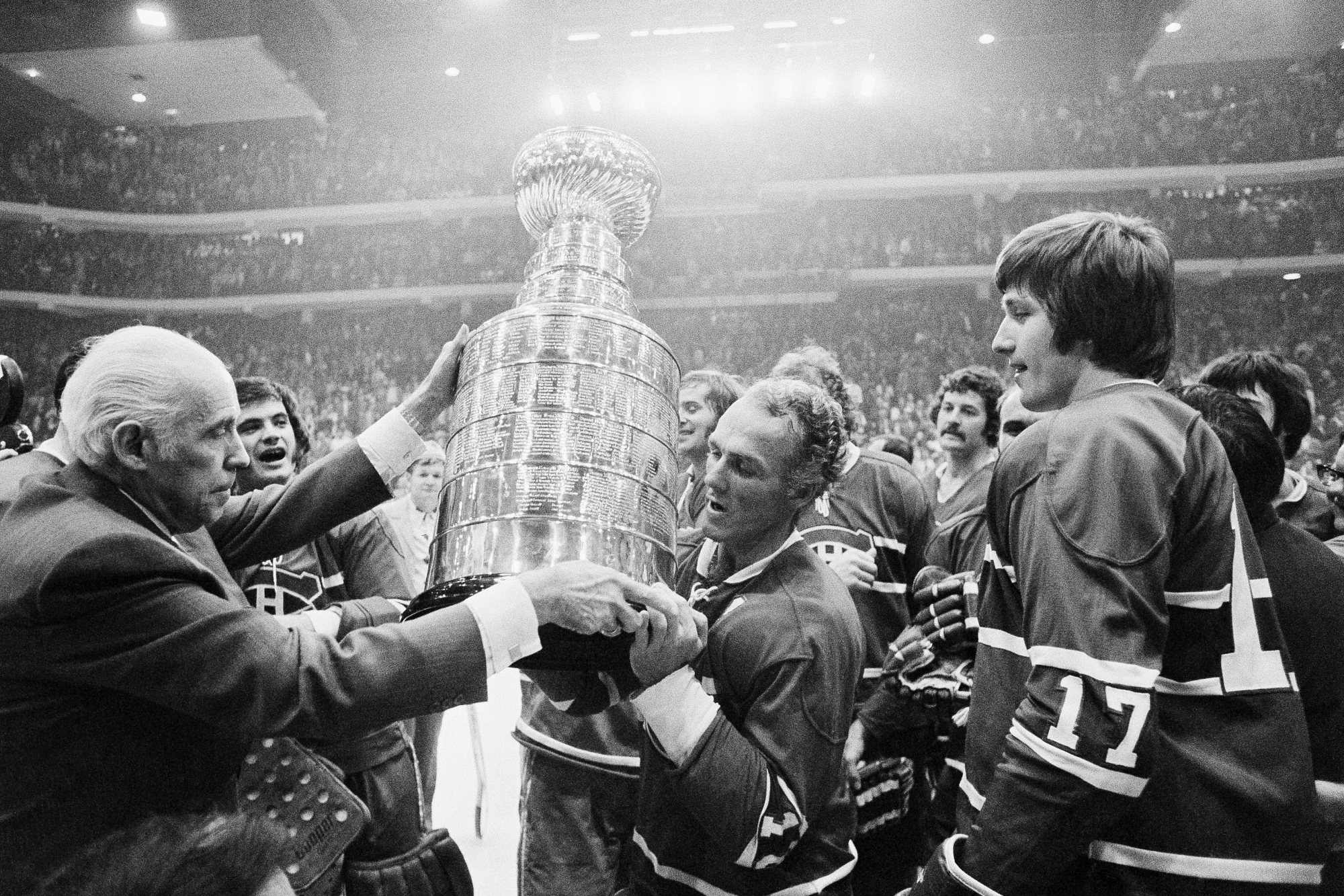 NHL president Clarence Campbell presents the Stanley Cup to Montreal Canadiens team captain Henri Richard after the Canadiens defeated the Chicago Blackhawks 6-4 in Chicago on May 10, 1973.