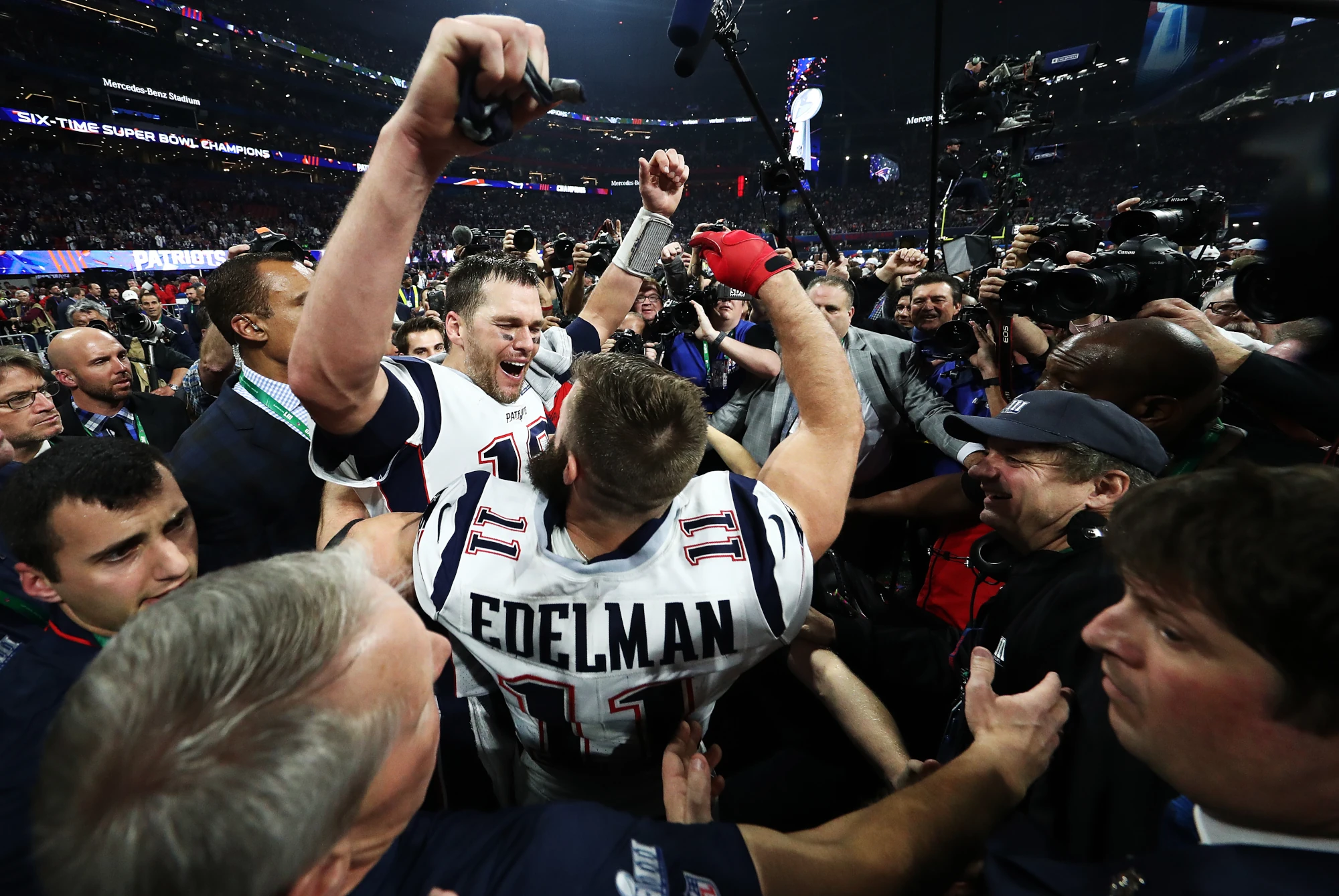 Tom Brady #12 of the New England Patriots and Julian Edelman #11 celebrate their teams 13-3 win over the Los Angeles Rams during Super Bowl LIII at Mercedes-Benz Stadium on February 03, 2019 in Atlanta, Georgia. 