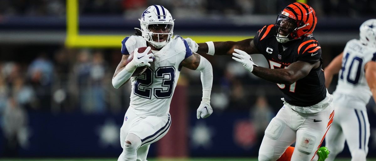 Rico Dowdle #23 of the Dallas Cowboys carries the ball against the Cincinnati Bengals during the second half of an NFL football game at AT&T Stadium on December 9, 2024 in Arlington, Texas.