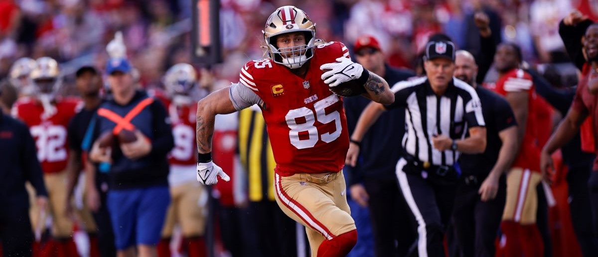 George Kittle #85 of the San Francisco 49ers runs after making a catch during the game against the Chicago Bears at Levi's Stadium on December 8, 2024 in Santa Clara, California. The 49ers defeated the Bears 38-13.