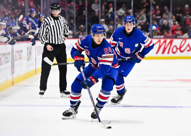 Cole Hutson #24 of Team USA skates the puck in the third period against Team Finland of the Group A match during the 2025 IIHF World Junior Championship at Canadian Tire Centre on December 29, 2024 in Ottawa, Ontario, Canada. Team Finland defeated Team USA 4-3 in overtime. 