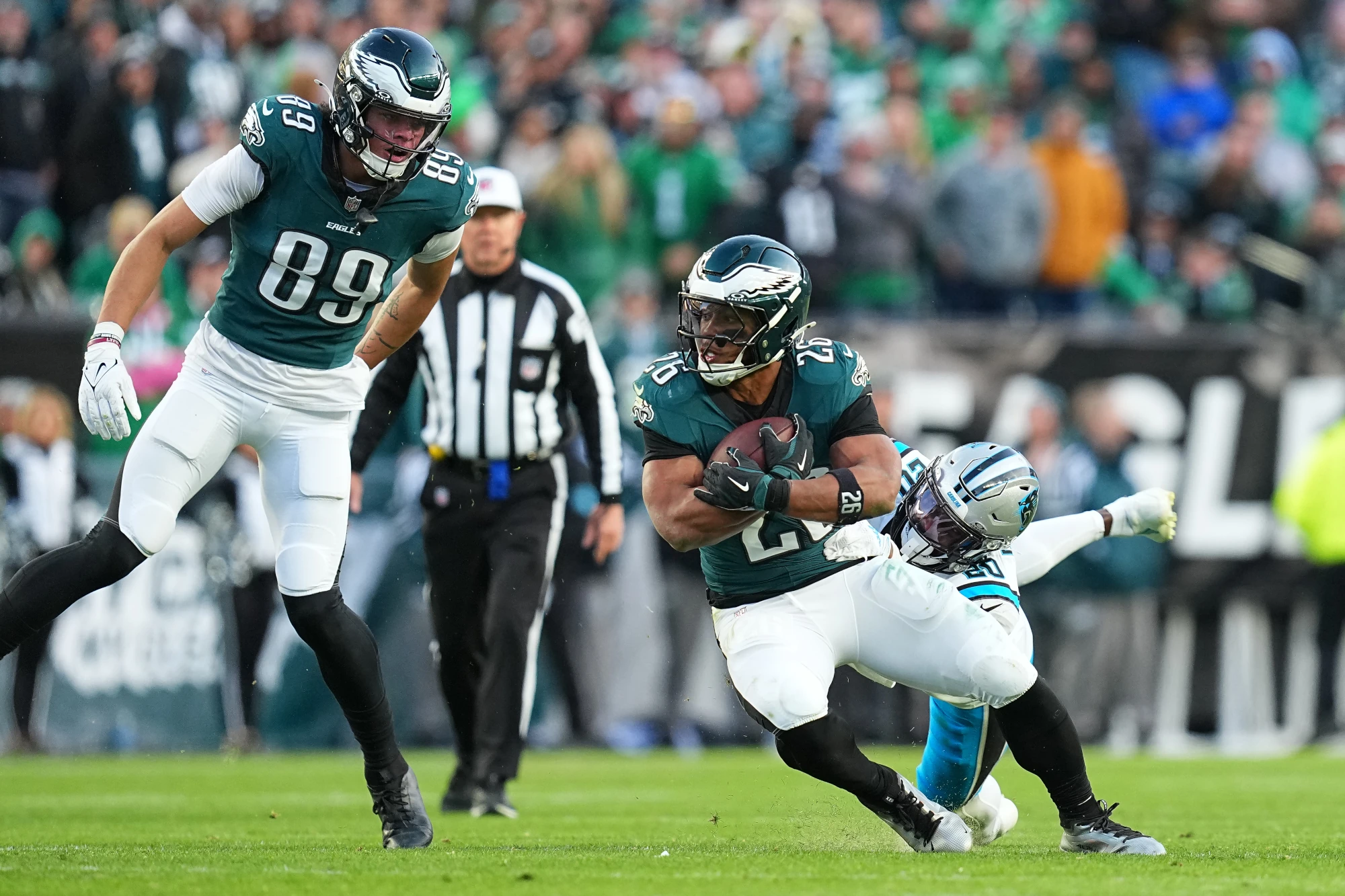 Saquon Barkley #26 of the Philadelphia Eagles runs the ball up the field against Jordan Fuller #20 of the Carolina Panthers in the fourth quarter of a game at Lincoln Financial Field on December 08, 2024 in Philadelphia, Pennsylvania. The Eagles currently have 3rd best Super Bowl Odds.