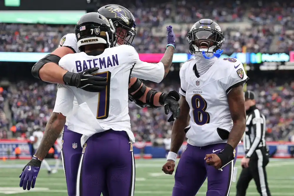 Rashod Bateman of the Baltimore Ravens celebrates with teammates after a second quarter touchdown against the New York Giants at MetLife Stadium on December 15, 2024 in East Rutherford, New Jersey.