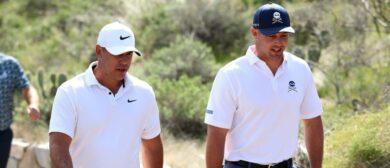 Brooks Koepka and Bryson DeChambeau walk to the fairway of the 3rd hole during the first round of the LIV Golf event at The Gallery Golf Club.