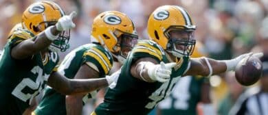 Green Bay Packers linebacker Eric Wilson (45) celebrates after intercepting a fourth quarter pass against the Indianapolis Colts wide receiver Michael Pittman Jr. (11) during their football game on Sunday, September 15, 2024 at Lambeau Field in Green Bay, Wis