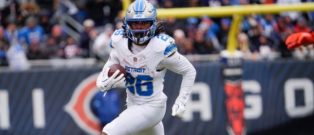 Detroit Lions running back Jahmyr Gibbs (26) runs down the field after receiving the ball at Soldier Field during a game against the Chicago Bears at in Chicago, Ill., on Sunday, Dec. 22, 2024.