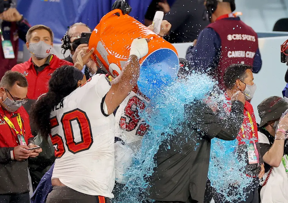 Head coach Bruce Arians of the Tampa Bay Buccaneers has Gatorade dumped on him after winning the Super Bowl against the Kansas City Chiefs at Raymond James Stadium in Tampa, Florida. The super bowl gatorade colour odds favour purple to win.