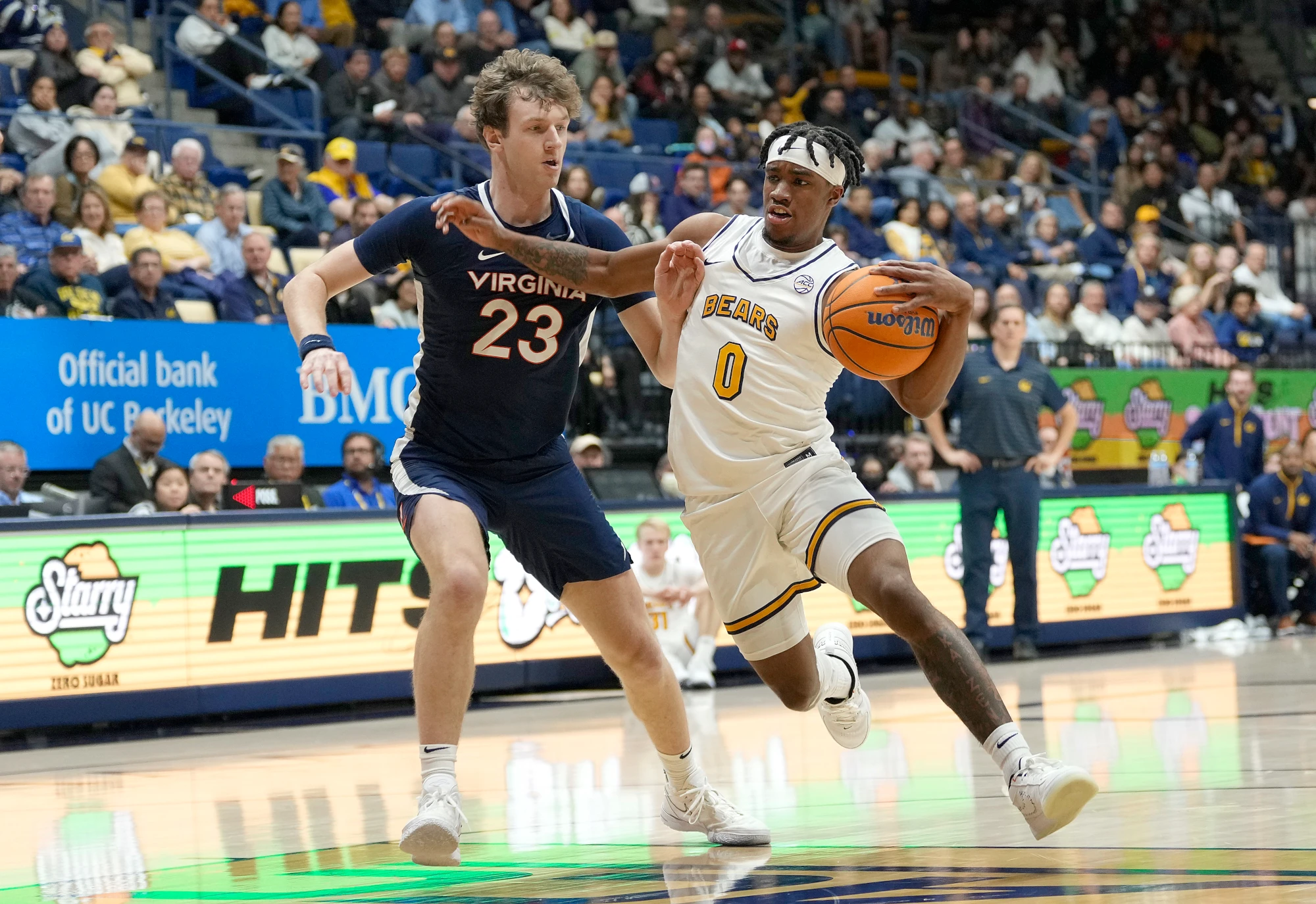 Jeremiah Wilkinson of the California Golden Bears drives to the basket on TJ Power of the Virginia Cavaliers during the first half of an NCAA basketball game at Haas Pavilion on January 08, 2025 in Berkeley, California.