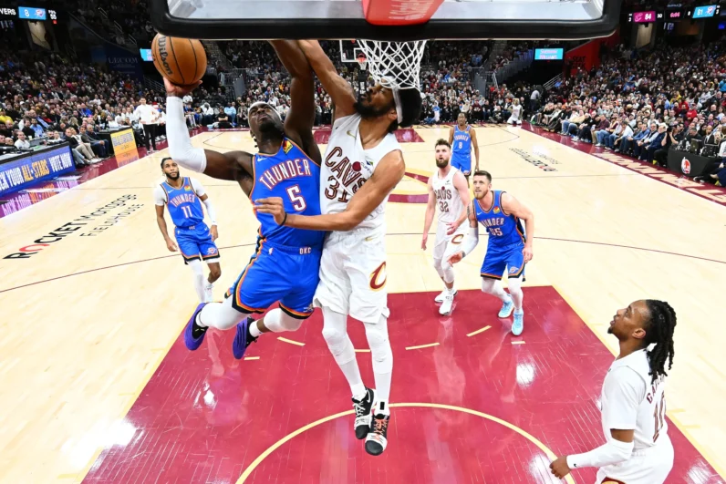 Luguentz Dort #5 of the Oklahoma City Thunder shoots over Jarrett Allen #31 of the Cleveland Cavaliers during the third quarter at Rocket Mortgage Fieldhouse on January 08, 2025 in Cleveland, Ohio. The Cavaliers defeated the Thunder 129-122. 