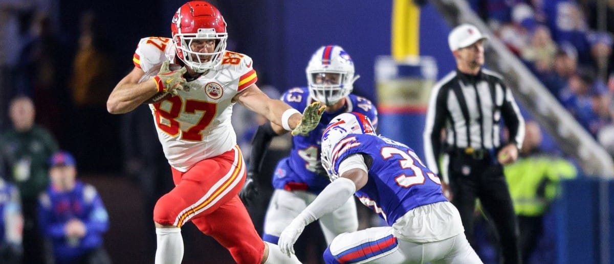 Travis Kelce #87 of the Kansas City Chiefs is tackled by Cam Lewis #39 of the Buffalo Bills during the third quarter at Highmark Stadium on November 17, 2024 in Orchard Park, New York.