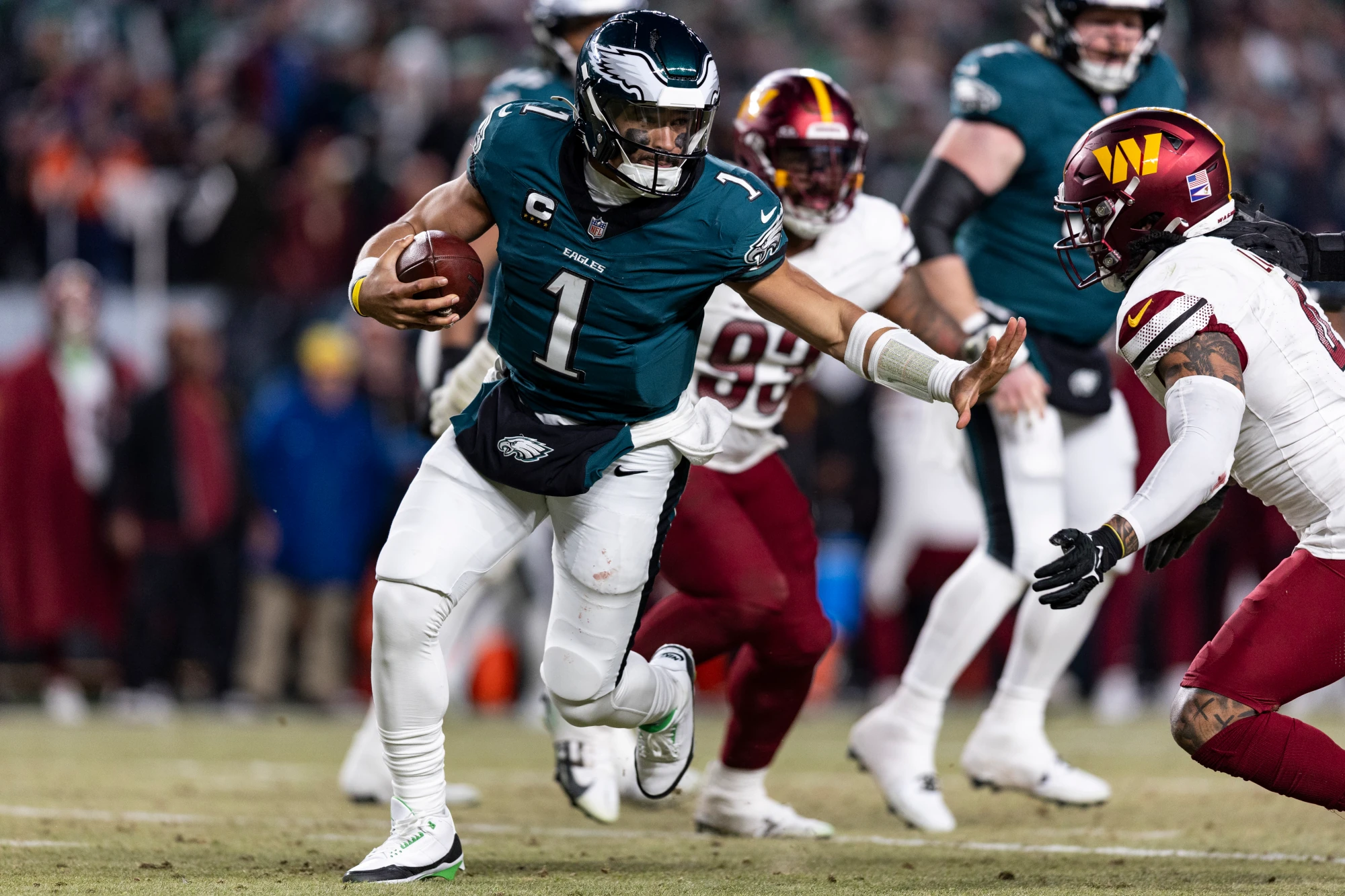 Jalen Hurts #1 of the Philadelphia Eagles runs the ball in the fourth quarter of the game against the Washington Commanders at Lincoln Financial Field on January 26, 2025 in Philadelphia, Pennsylvania. The Eagles beat the Commanders 55-23. 